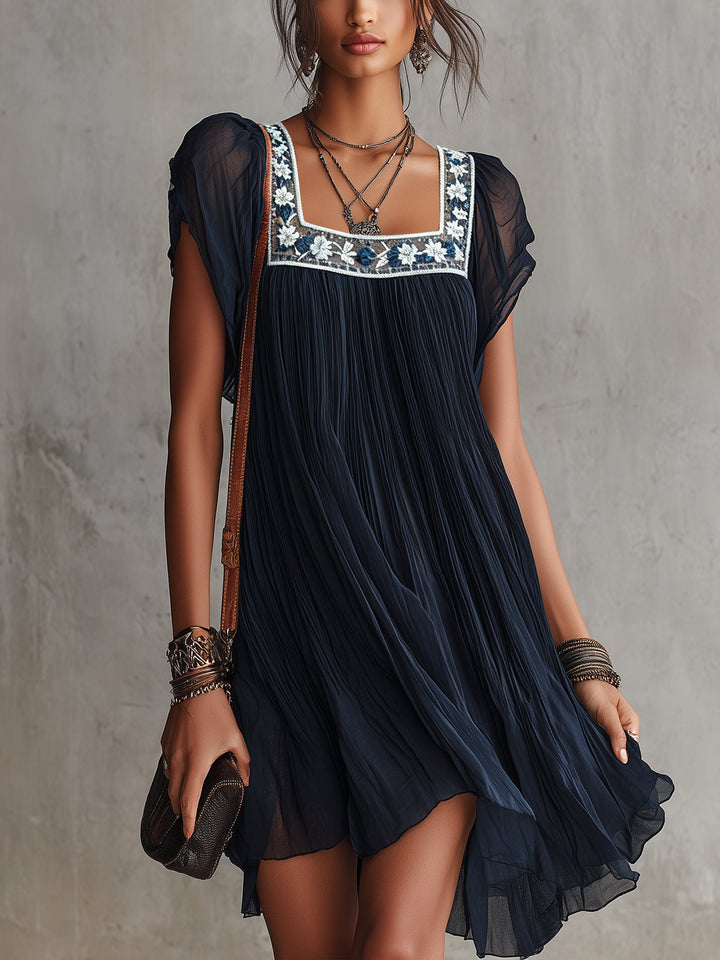 Grace | Pleated Satin Mini Dress with Navy Floral Embroidery