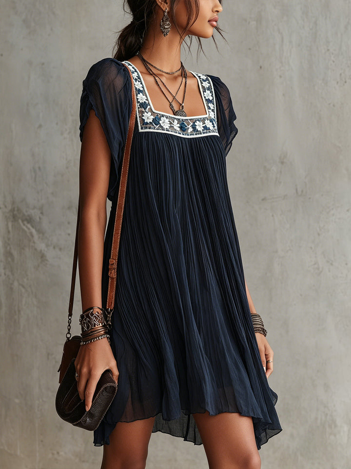Grace | Pleated Satin Mini Dress with Navy Floral Embroidery